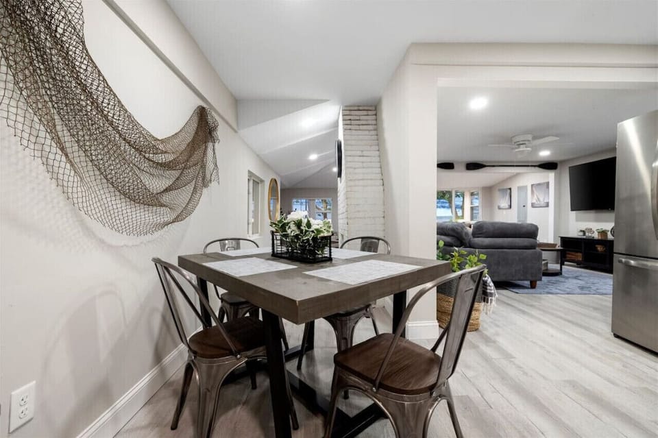 Modern dining table set for four, designed for convenience and comfort in a contemporary setting.