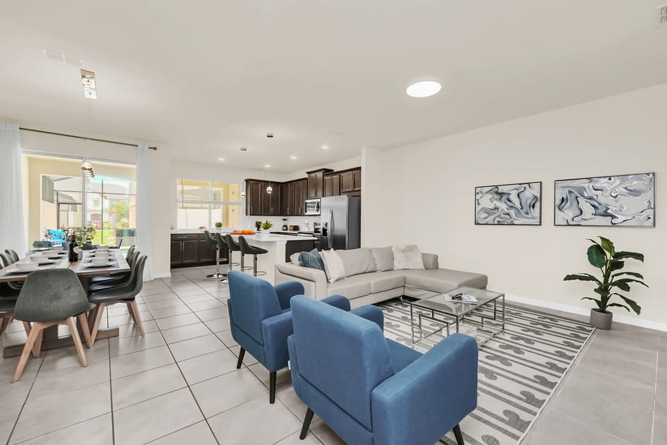 Open-concept living area with modern kitchen and dining space.