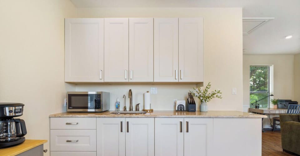 Everything you really need: Kitchenette with dining, microwave, coffee, and the basics