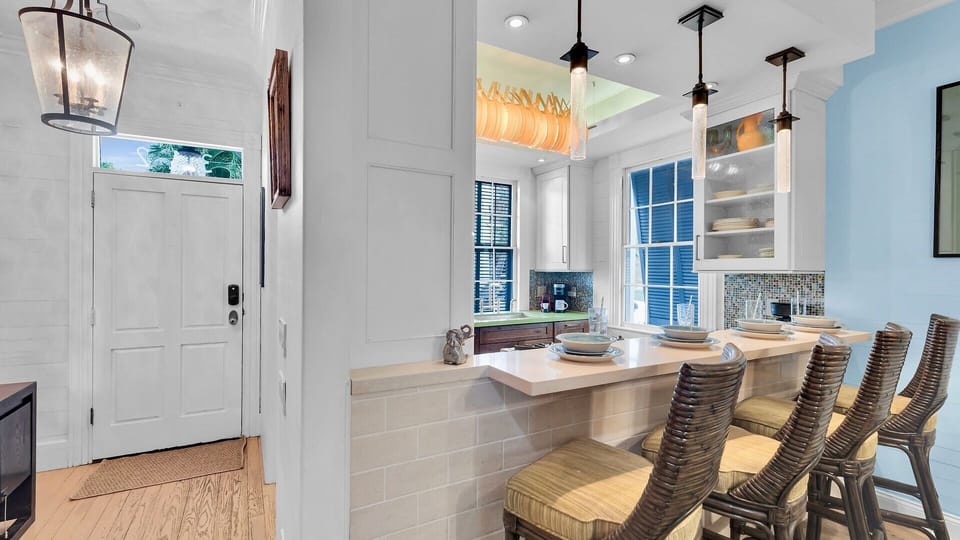 Your bright kitchen features modern appliances and a breakfast bar where you can enjoy morning coffee while natural light streams through the windows.