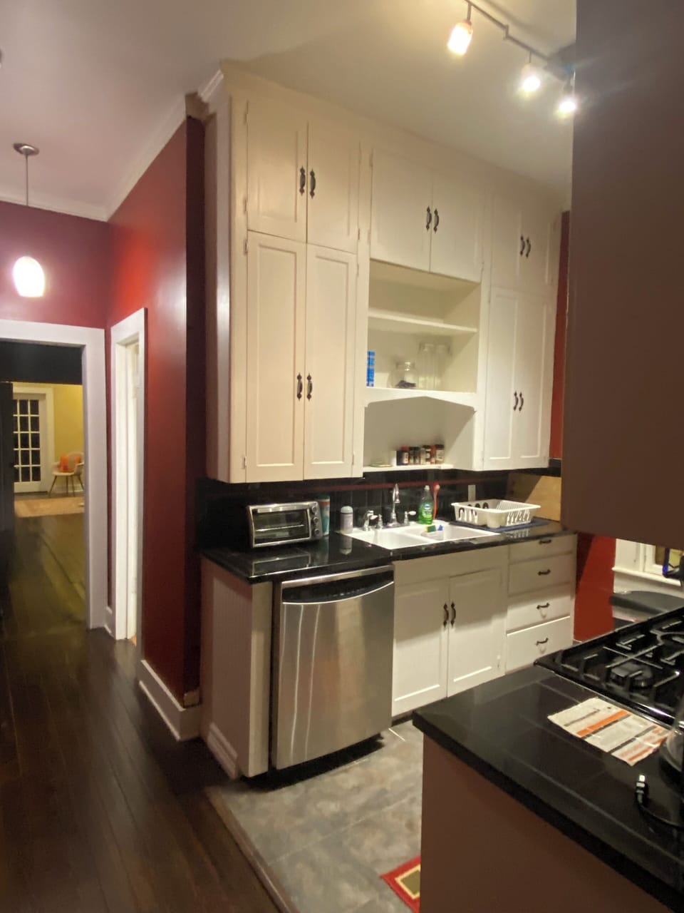 Kitchen equipped with a dishwasher, toaster oven, and drawers with flatware, etc