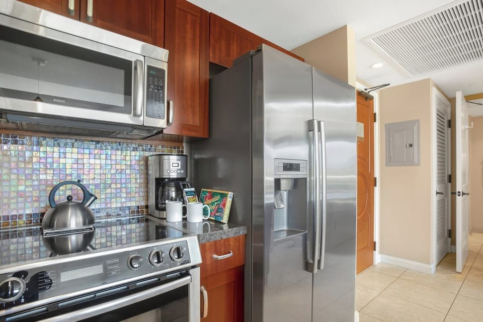     This sleek entry opens to a beautifully equipped kitchen oasis