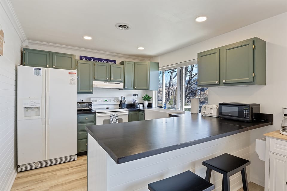 Kitchen Including Microwave, Toaster, Toaster Oven, Blender, and All Kitchen Items To Cook a Great Meal. 