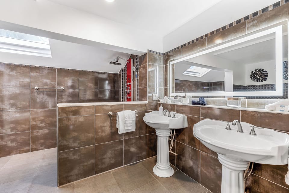 Pedestal sinks with glass enclosed shower (newly installed)