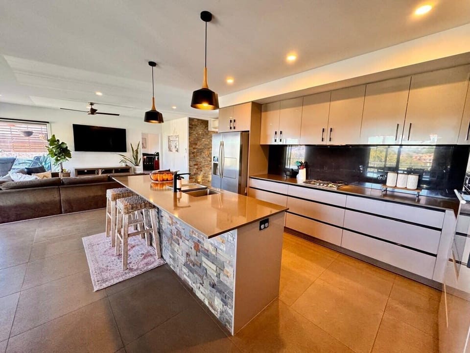 Kitchen has gas cooktop and high end appliances