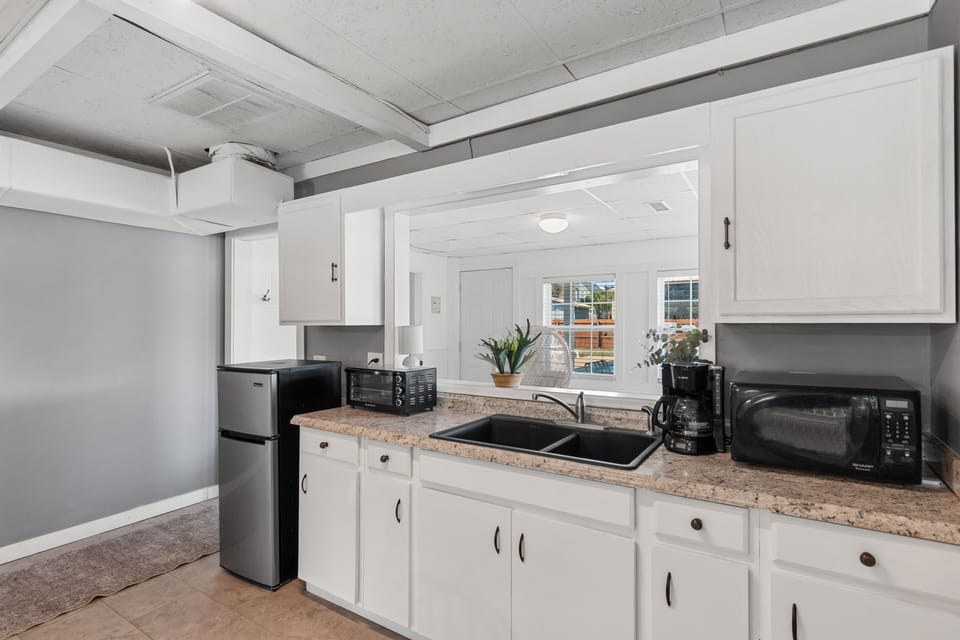 Your fully-equipped kitchen features everything you need, from granite countertops to modern appliances and plenty of cabinet space for all your culinary adventures.