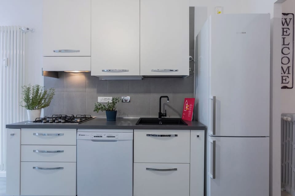 Apartment, Balcony, City View | Private kitchen | Espresso maker, highchair