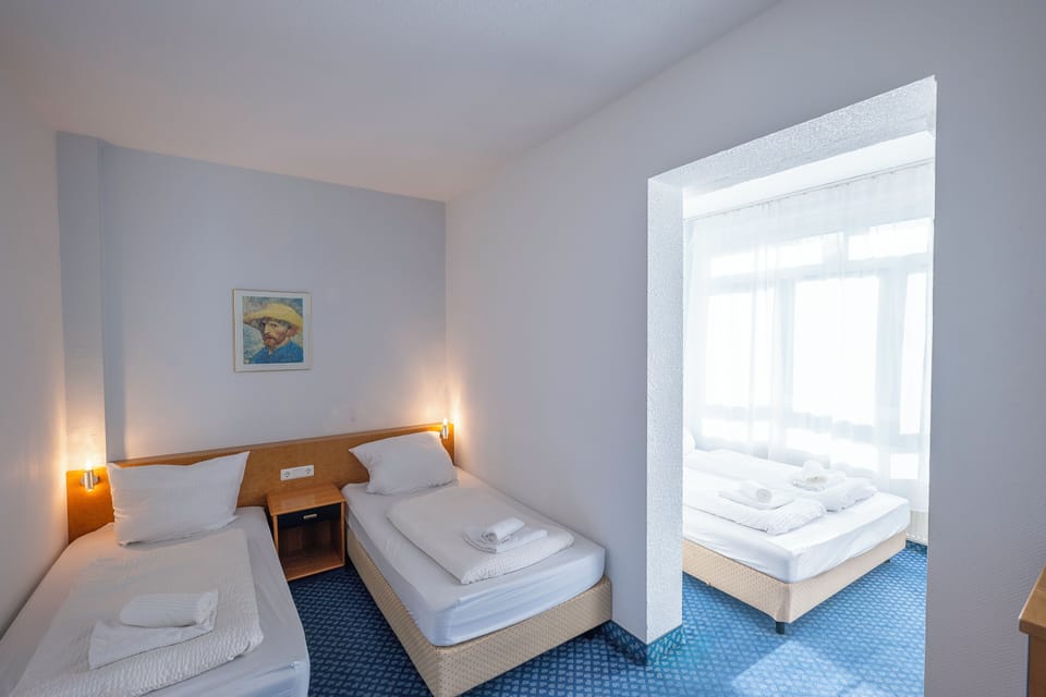 Family Triple Room | Desk, laptop workspace, free WiFi, bed sheets