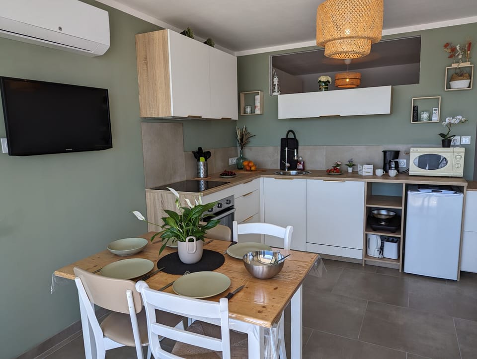 Modern equipped kitchen open to the warm living room