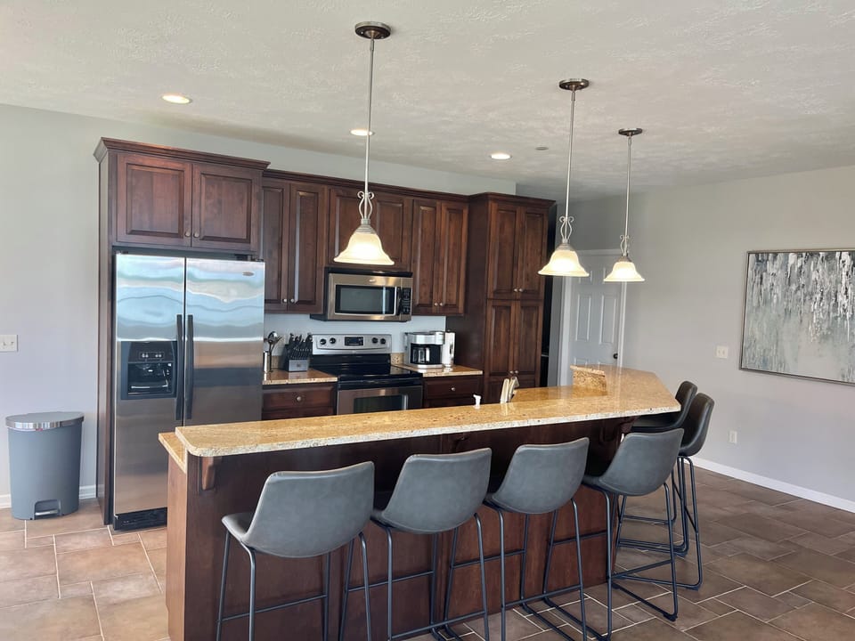 Six bar stools to facilitate friends and family time during meal prep