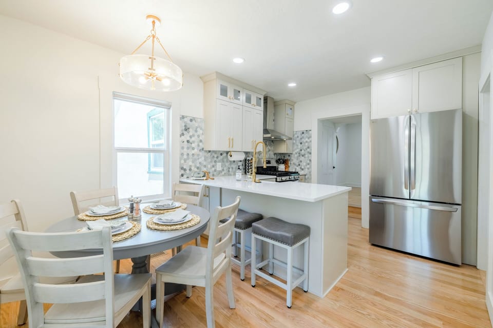 Dinning area near kitchen, seating for 5 with expanding table leave for 7