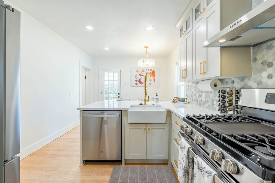 Kitchen with all new stainless appliances, quartz countertops, farmhouse sink