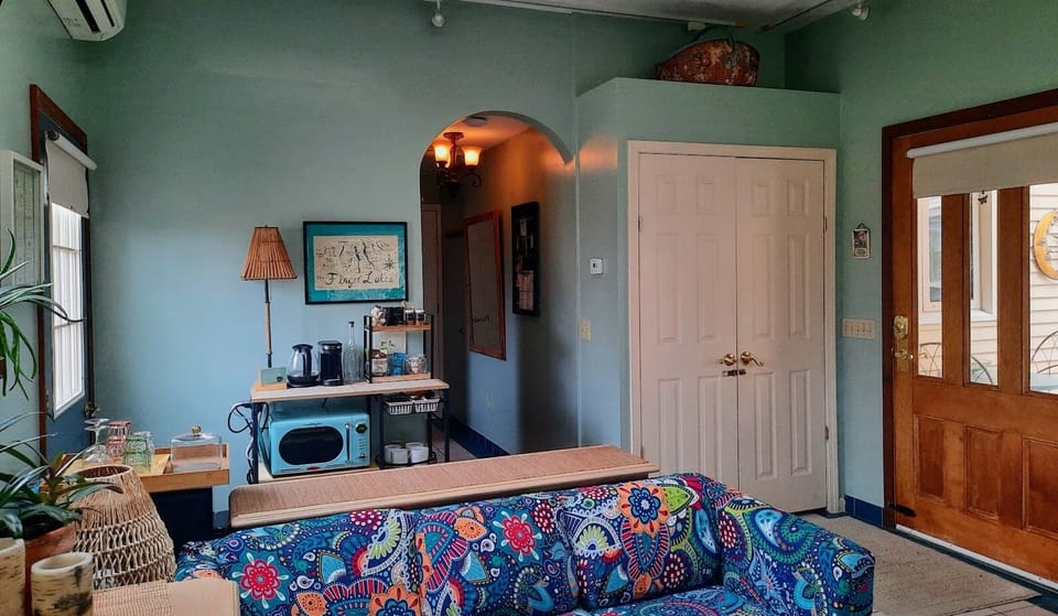 spacious studio space with high ceilings and surround track lighting