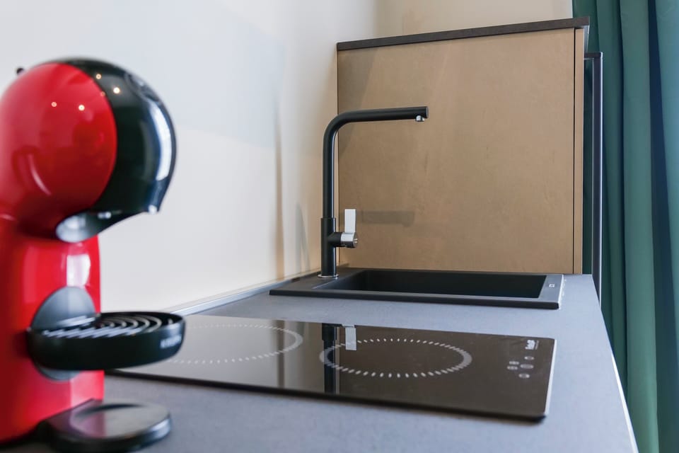 Family Suite, Balcony, City View | Private kitchenette | Espresso maker, coffee/tea maker, electric kettle, coffee grinder