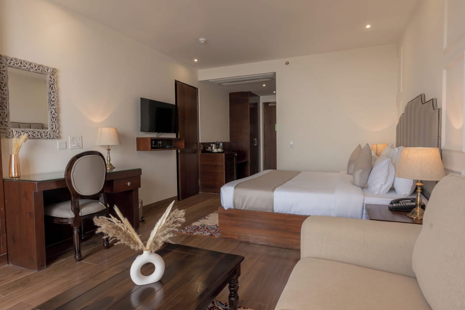 Luxury Double Room, City View | Living area | 40-inch Smart TV with satellite channels