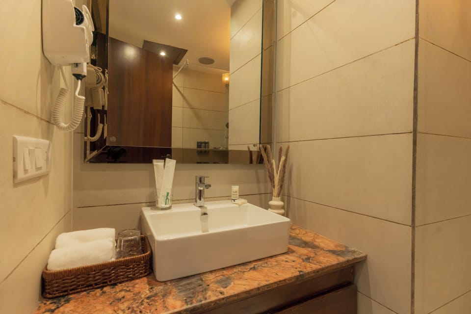Shower, hair dryer, slippers, towels