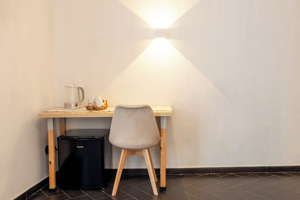Desk, laptop workspace, cribs (free), WiFi (free)