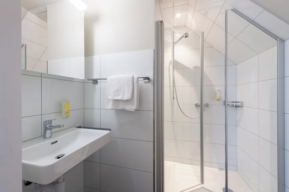 Single Room, Courtyard View | Bathroom | Shower, hair dryer, towels, soap