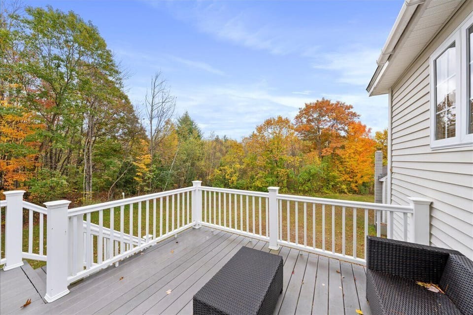 Balcony with seasonal views of our pond and mountains in the distance