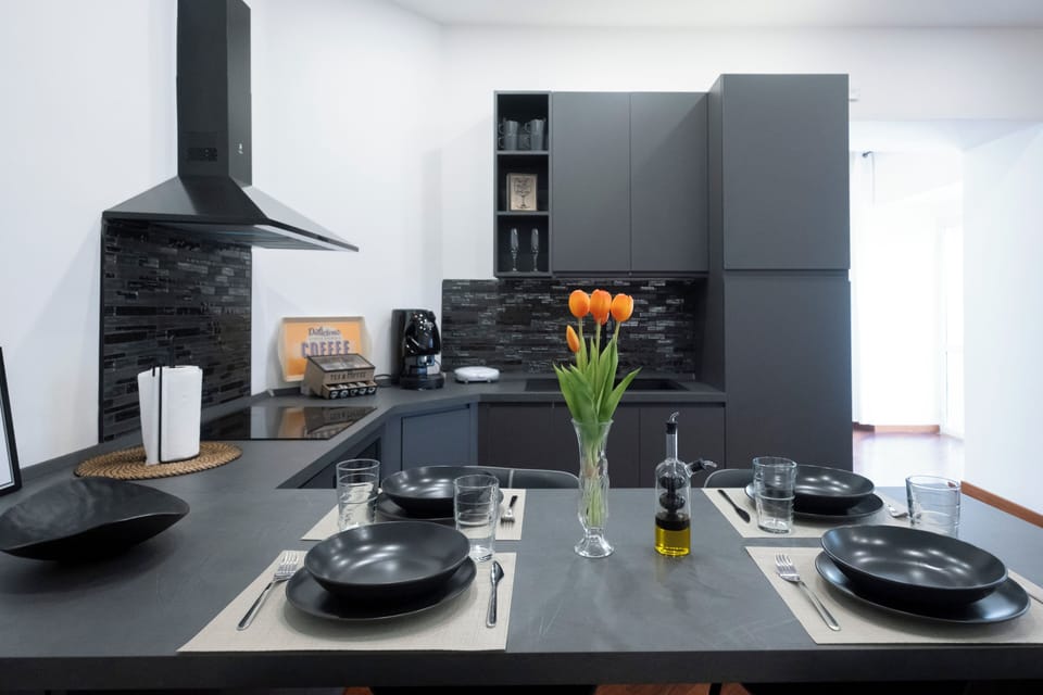 Family Suite, Balcony, City View | Private kitchen | Espresso maker, electric kettle, cleaning supplies, dining tables