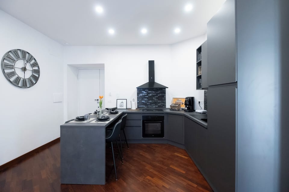 Family Suite, Balcony, City View | Private kitchen | Espresso maker, electric kettle, cleaning supplies, dining tables