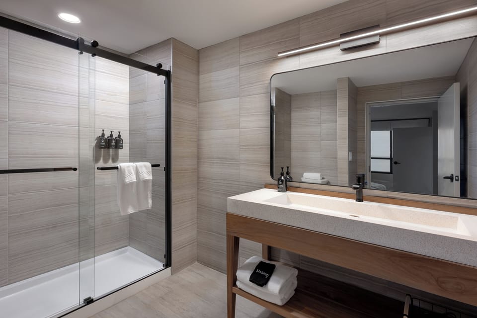 Suite, Lake View | Bathroom | Hair dryer, towels, soap, shampoo