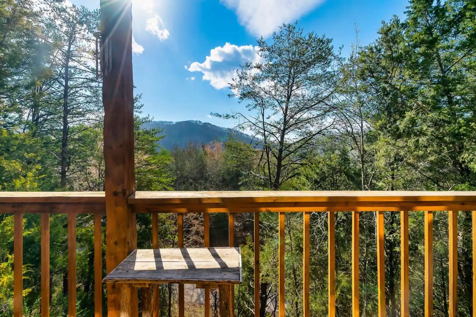Step into serenity with this charming wooden deck setup, perfect for enjoying your morning coffee or a good book 