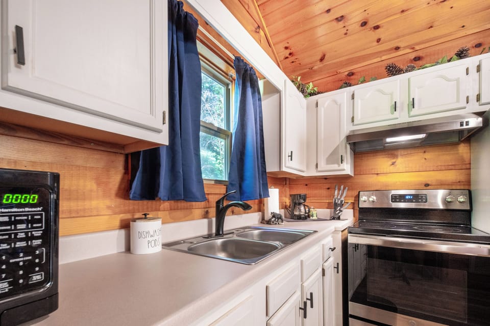 Cabin kitchen with woodsy vibes and all the essentials for home-cooked meals.