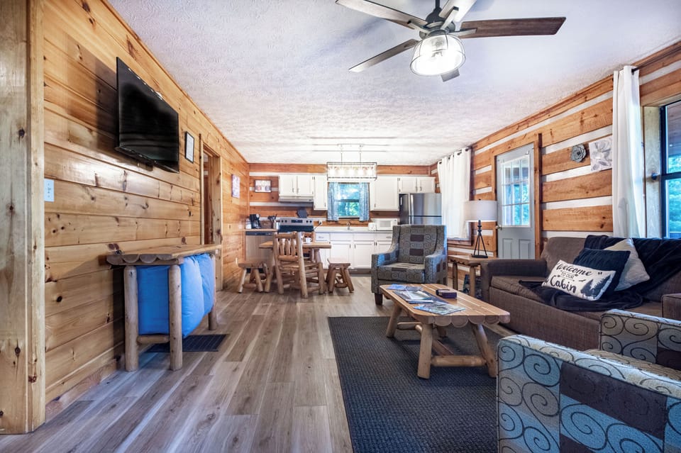 Living Room: Rustic charm meets modern comfort with stunning wood accents and ample natural light!