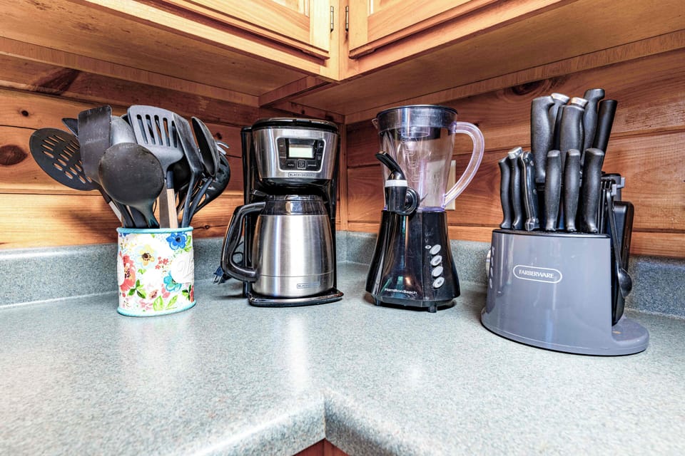 Cook, sip, and prep with ease—modern appliances meet rustic charm.