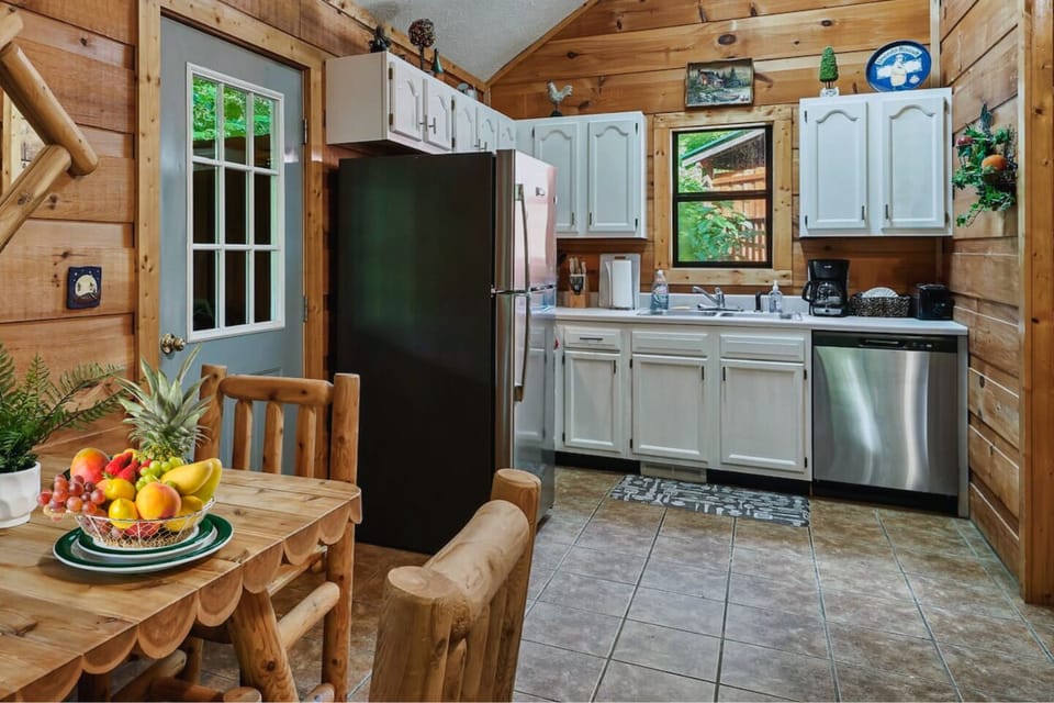 A fully equipped kitchen with rustic cabin charm, everything you need to cook delicious meals.