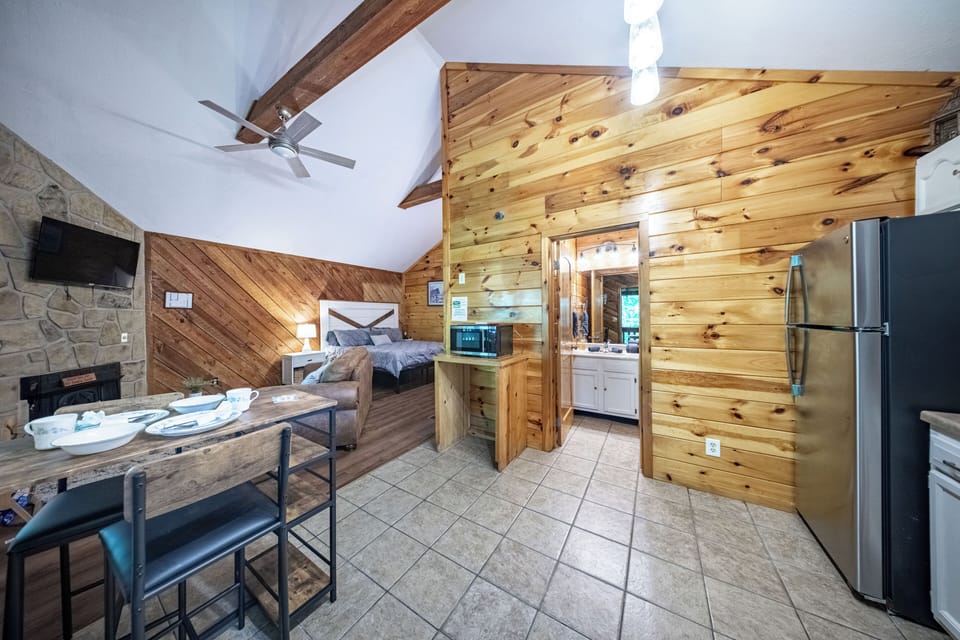 Enjoy a cozy king bed, dining nook, and kitchenette with modern amenities.