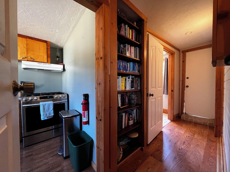 Hallway to second twin bedroom.  Lots of books too!