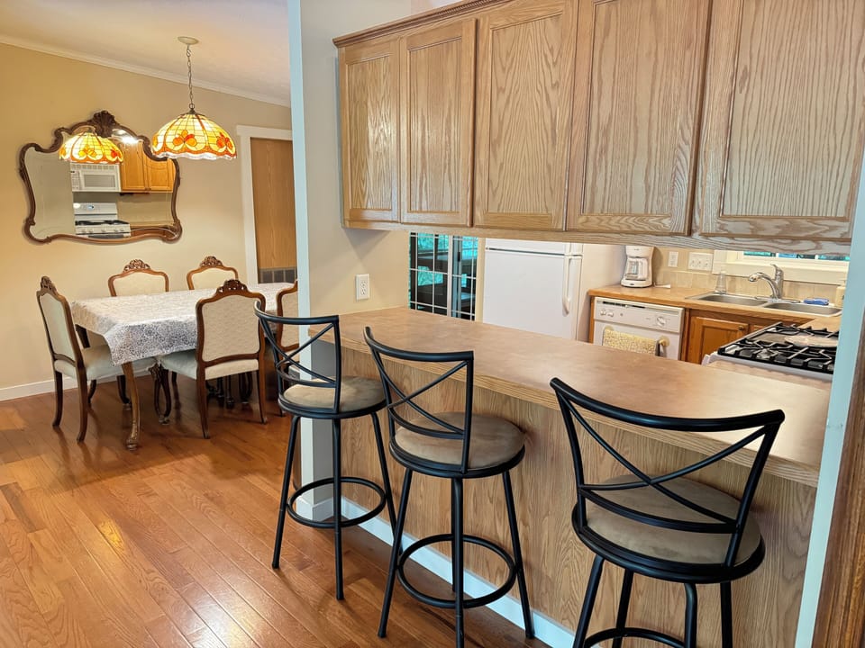 Breakfast bar by kitchen.