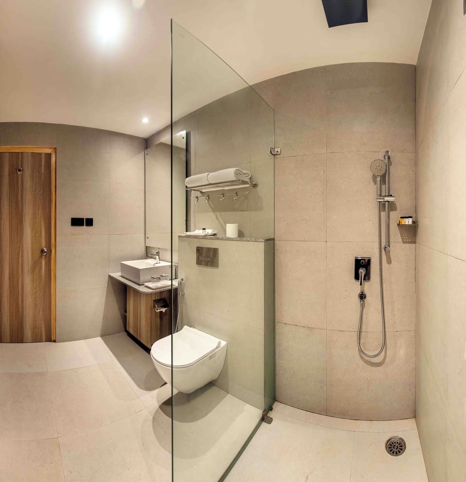 Shower, free toiletries, slippers, towels