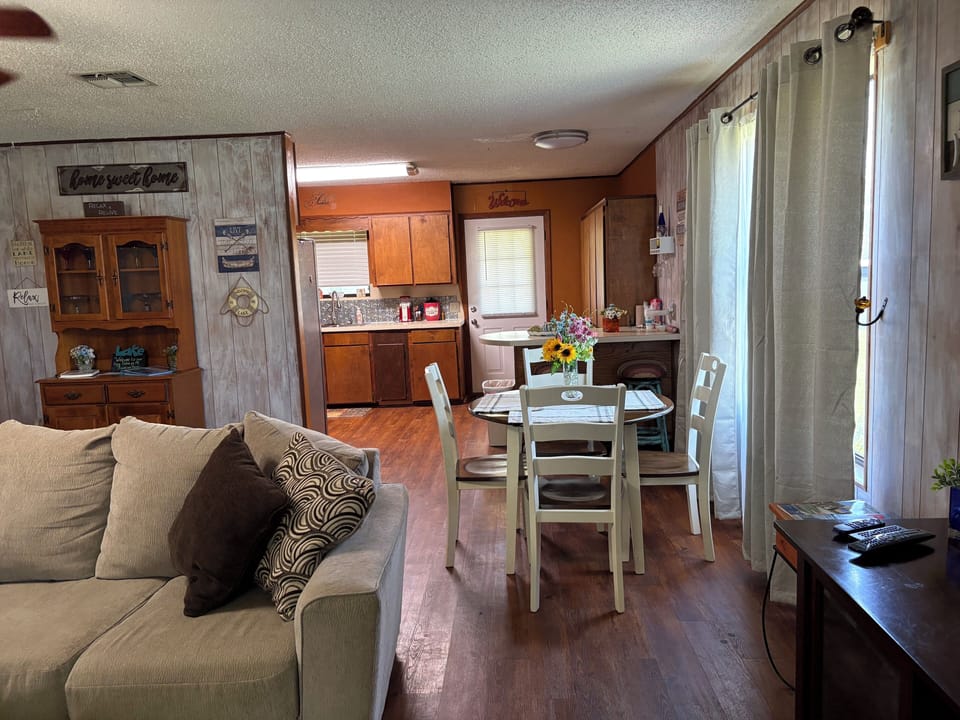 Living room, view of Dinette & Kitchen.