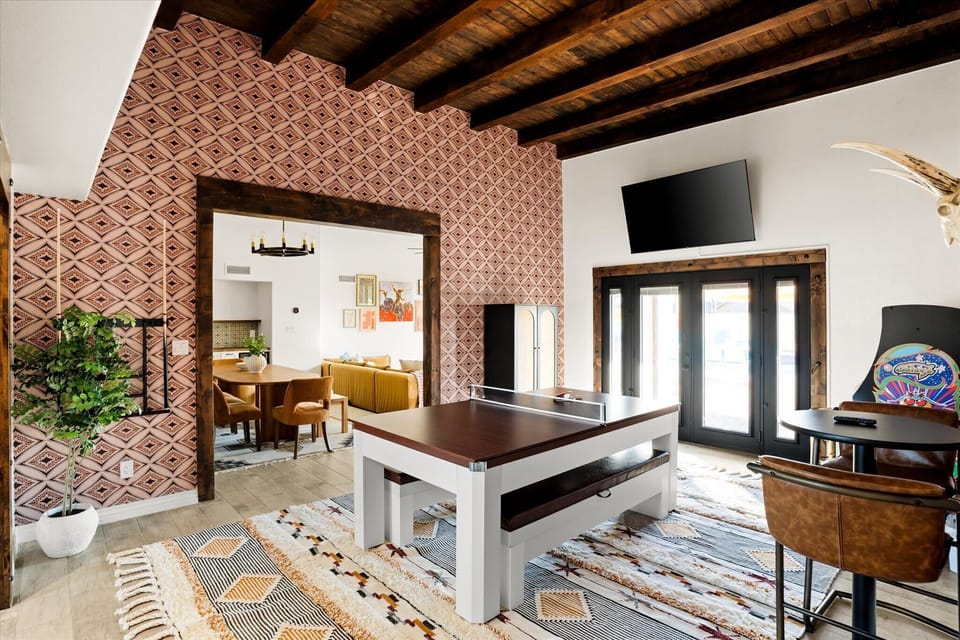 Our gaming area offers something for everyone with a ping pong table, smart TV, and arcade games, ensuring hours of entertainment