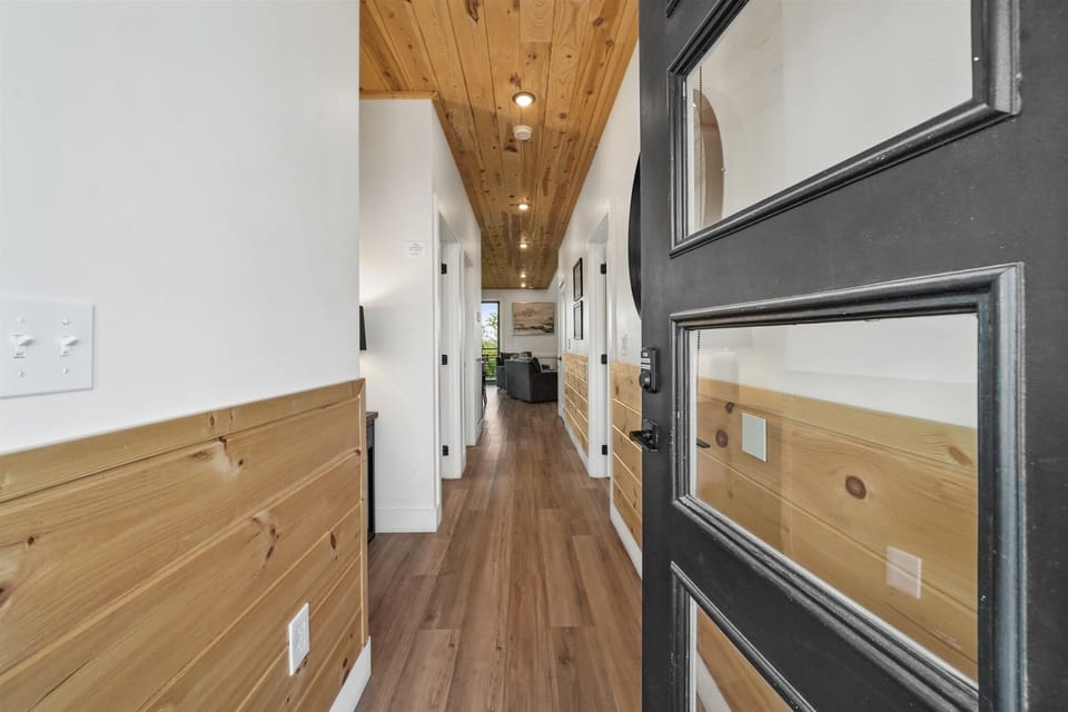 Step inside to a stunning blend of wood accents and bright natural light!