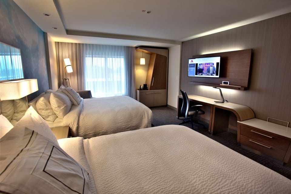 Room, 2 Queen Beds | Desk, blackout drapes, iron/ironing board, free rollaway beds