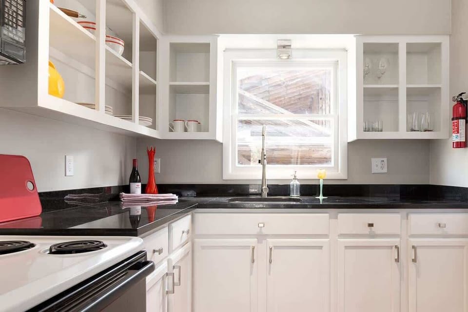 Full kitchen with granite countertops.