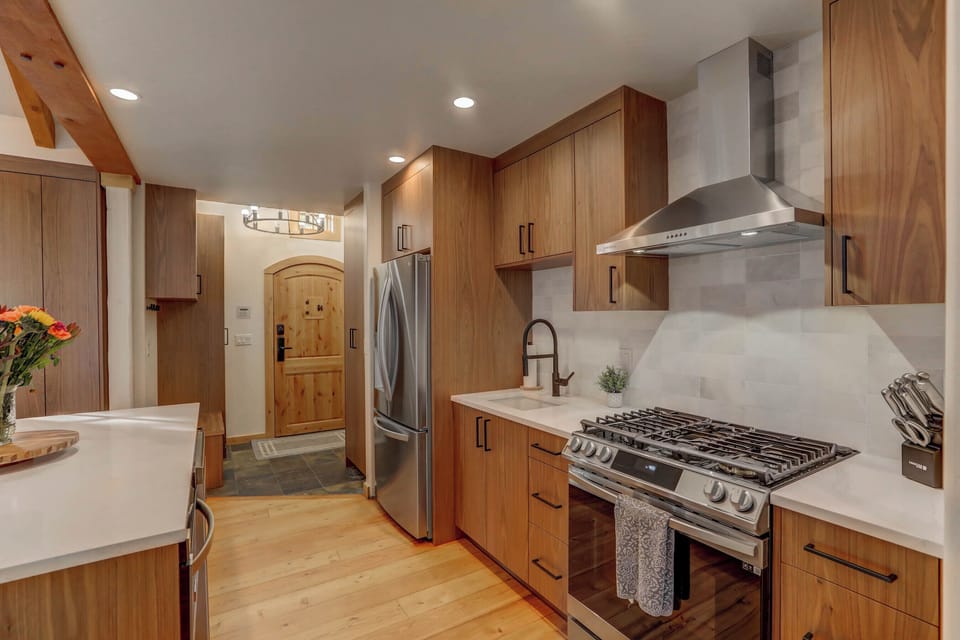 You'll be able to whip up home cooked meals in this well-stocked kitchen, complete with stainless appliances and a gas range