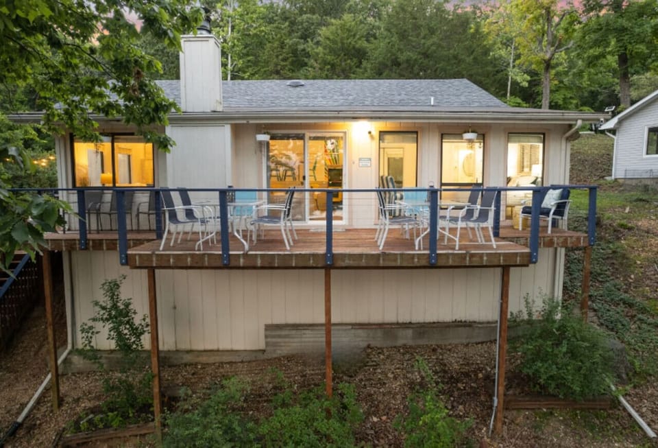 Deck with lake view and outdoor dining area