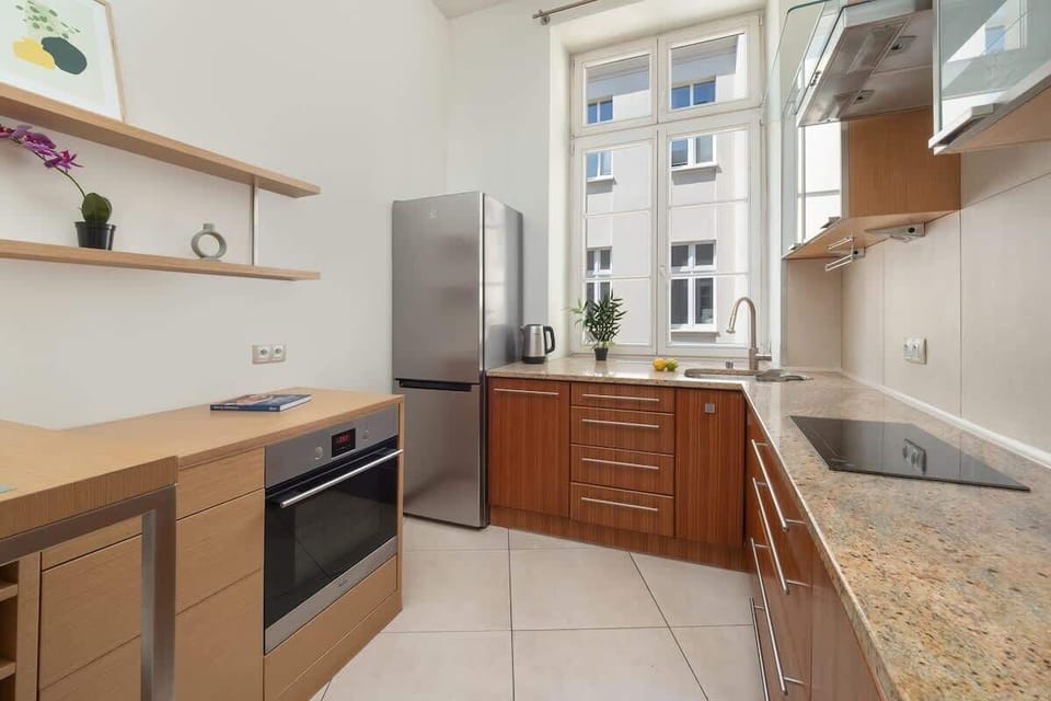  Kitchenette with functional appliances, including a fridge and microwave, providing comfort during your stay.