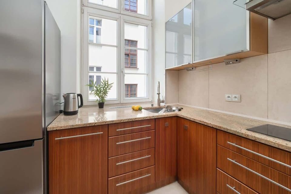  Kitchenette with a spacious countertop and modern appliances, perfect for meal preparation.