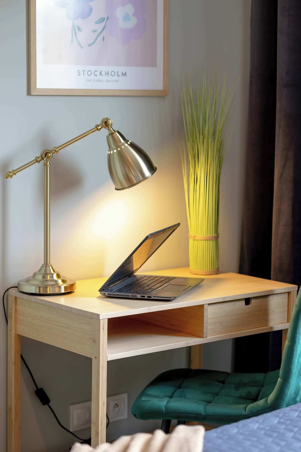 A small desk and chair setup in the corner, perfect for working or reading, with a plant adding freshness.

