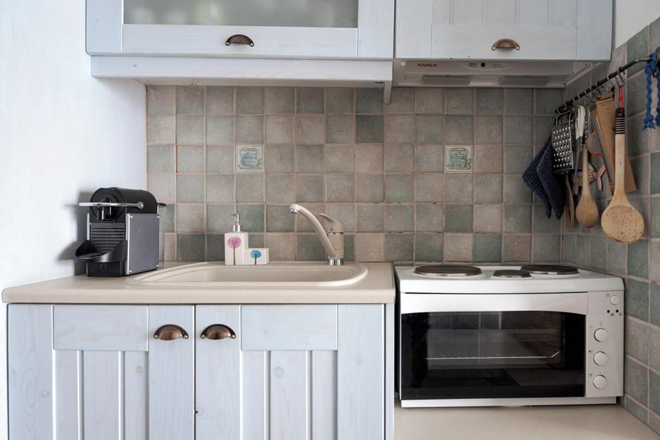 Traditional Apartment, 2 Bedrooms, Sea View, Beachfront | Private kitchenette | Fridge, microwave, oven, stovetop