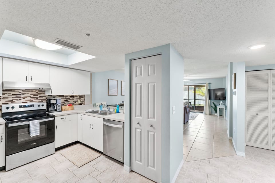 View of kitchen including pantry space to store food. 