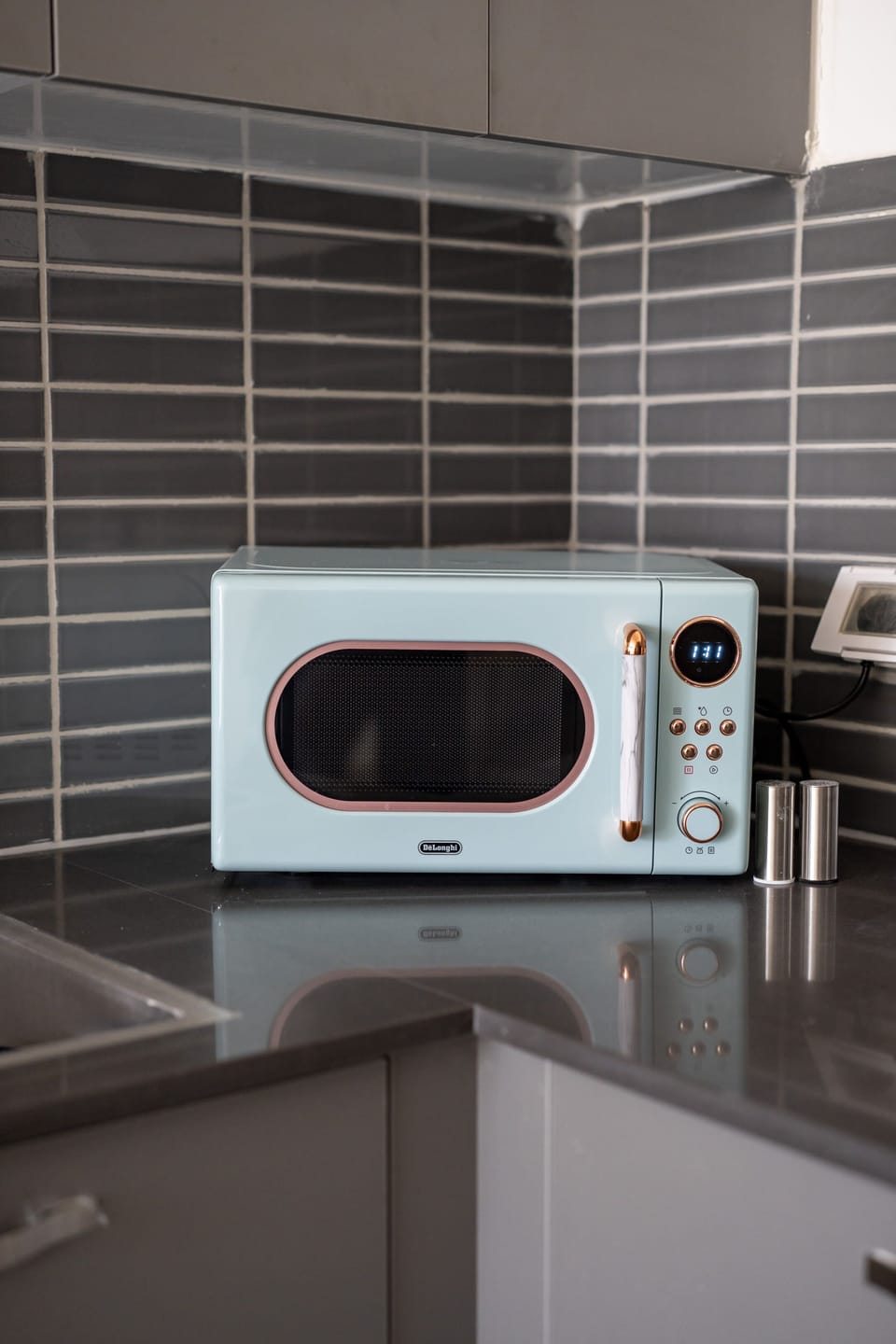 Well equipped kitchen corner includes modern appliances ready for quick breakfasts before heading outside today.