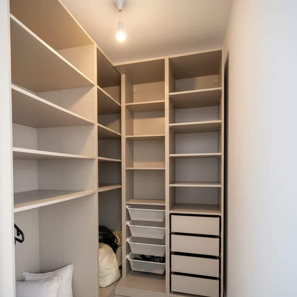 Large walk-in wardrobe provides organized storage, helping longer stays feel effortless and comfortably settled inside.