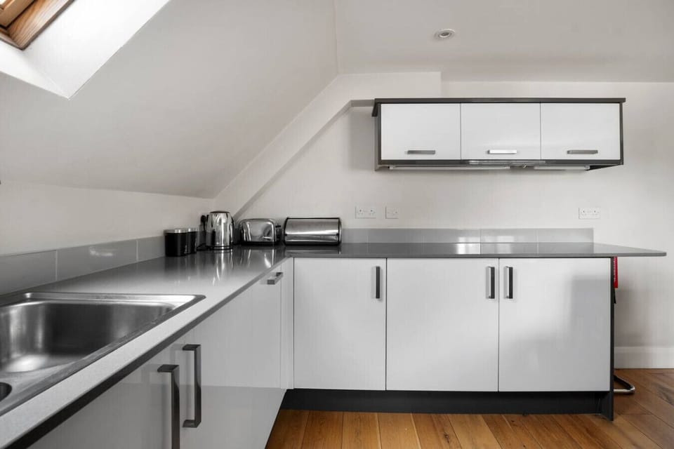 Stainless steel worktops and full kitchen setup